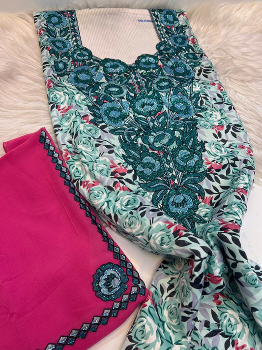 Teal and rose print mukhawar fabric with teal embroidered neckline and bright pink shayla